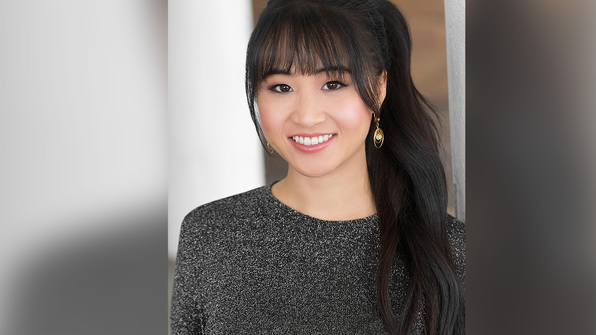 Xanthe Huynh, voice actress guest posing with a smile